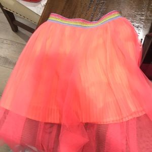 Pleated shorts with tulle overlay
